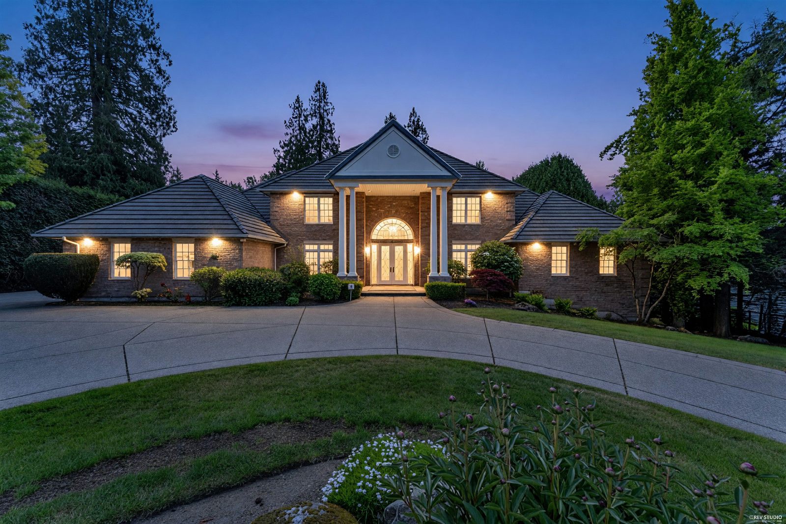 Estate home at twilight, South Surrey